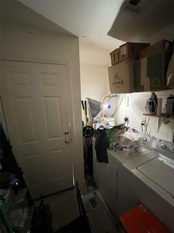 3319 N Dorgenois St, New Orleans, LA 70117 - clothes washing area with separate washer and dryer