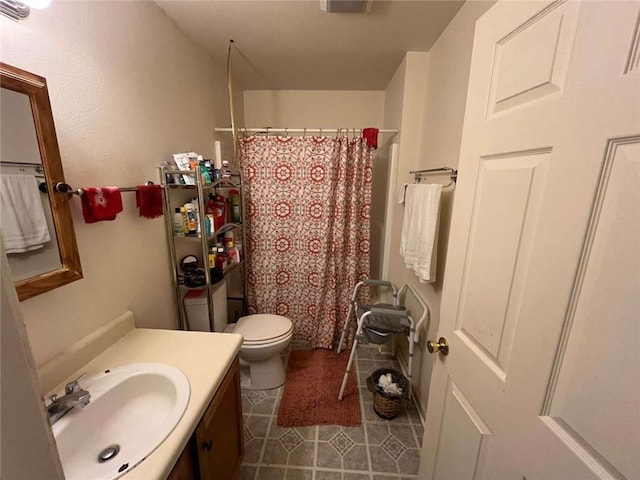 3319 N Dorgenois St, New Orleans, LA 70117 - full bathroom featuring vanity, tile patterned floors, toilet, and a shower with curtain