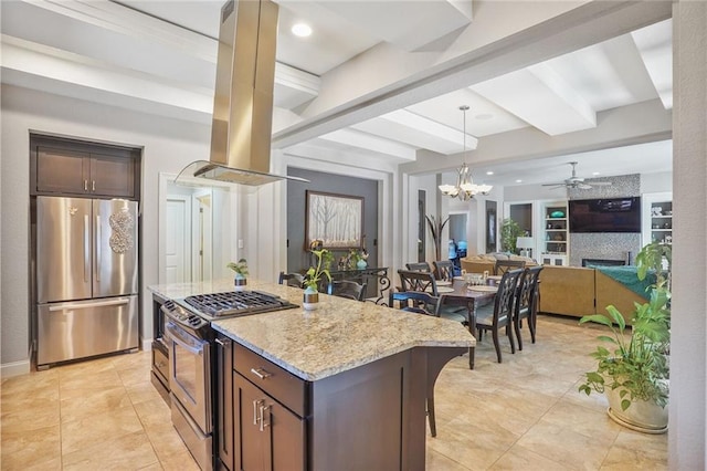 kitchen with stainless steel appliances, island range hood, light stone countertops, beam ceiling, and open floor plan