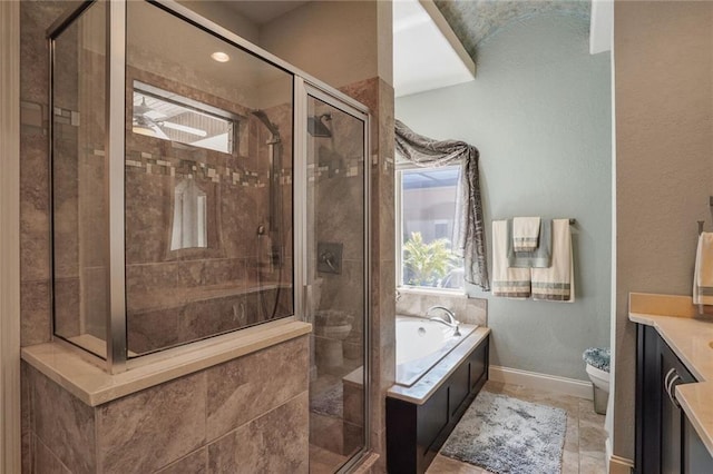 full bathroom with a garden tub, vanity, a stall shower, toilet, and baseboards