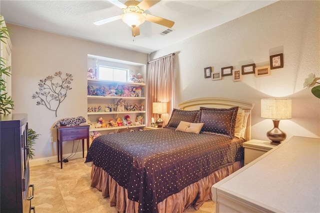 bedroom featuring ceiling fan and baseboards