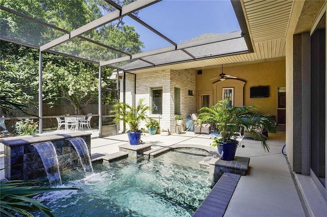 view of pool with a patio, a ceiling fan, and a lanai