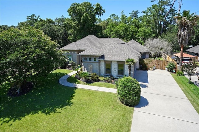 view of front of home with concrete driveway and brick siding