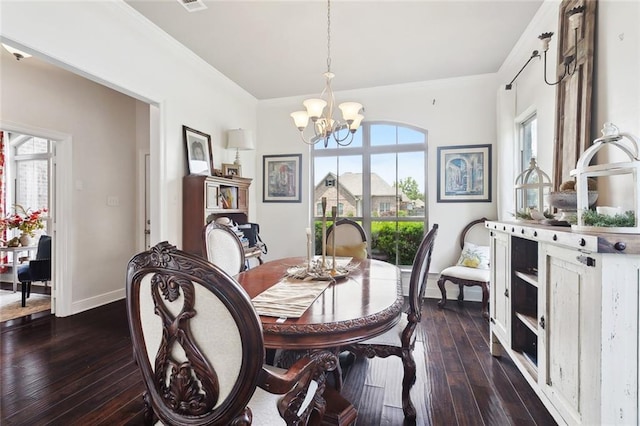 28591 Water Oak Loop, Ponchatoula, LA 70454 - dining space featuring a chandelier, dark wood-style floors, and baseboards