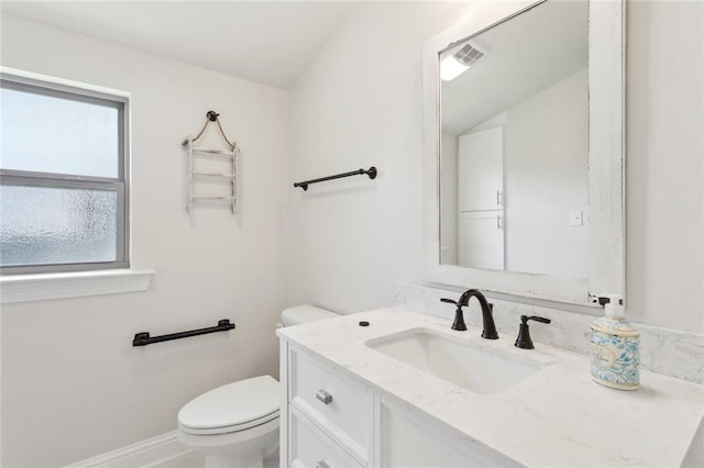 28591 Water Oak Loop, Ponchatoula, LA 70454 - bathroom with toilet, vanity, and baseboards