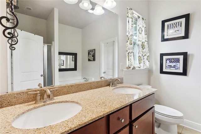 28591 Water Oak Loop, Ponchatoula, LA 70454 - bathroom featuring toilet, a shower stall, double vanity, tile patterned floors, and a garden tub