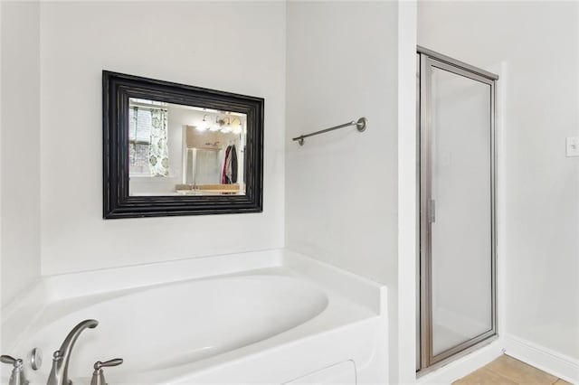 28591 Water Oak Loop, Ponchatoula, LA 70454 - full bathroom featuring a garden tub, a shower stall, and tile patterned flooring