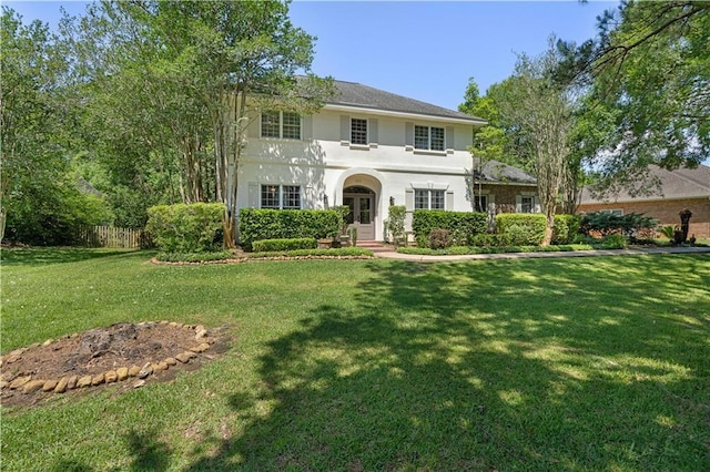 125 Bent Tree Ct, Covington, LA 70433 - view of front of house with french doors, a front lawn, and stucco siding