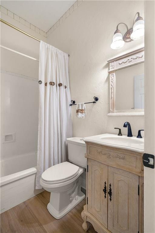 125 Bent Tree Ct, Covington, LA 70433 - bathroom featuring wood finished floors, toilet, shower / bathtub combination with curtain, and vanity