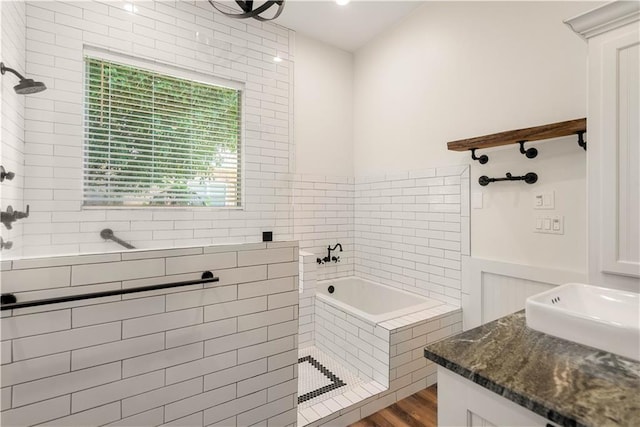 125 Bent Tree Ct, Covington, LA 70433 - full bath featuring tiled shower, a bath, wood finished floors, and a sink