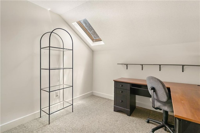 125 Bent Tree Ct, Covington, LA 70433 - carpeted home office with a skylight, vaulted ceiling, and baseboards