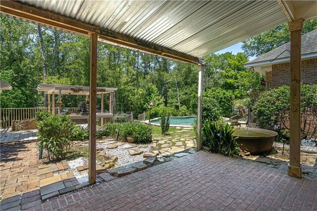 125 Bent Tree Ct, Covington, LA 70433 - view of patio / terrace with an outdoor pool, a pergola, and view of scattered trees