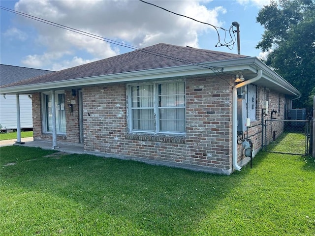 341 Soniat Ave, Harahan, LA 70123 - view of side of property with brick siding, roof with shingles, and central AC