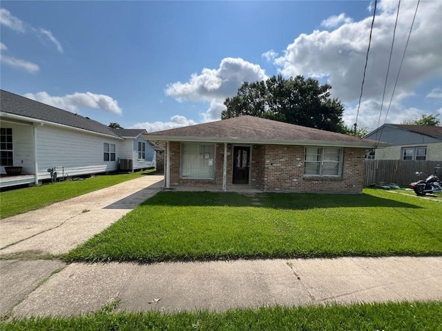 341 Soniat Ave, Harahan, LA 70123 - view of front of property featuring brick siding, driveway, and cooling unit