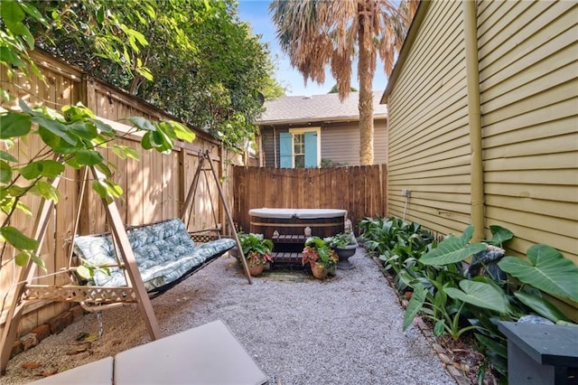 2000 St Philip St, New Orleans, LA 70116 - fenced backyard with a hot tub and a patio area