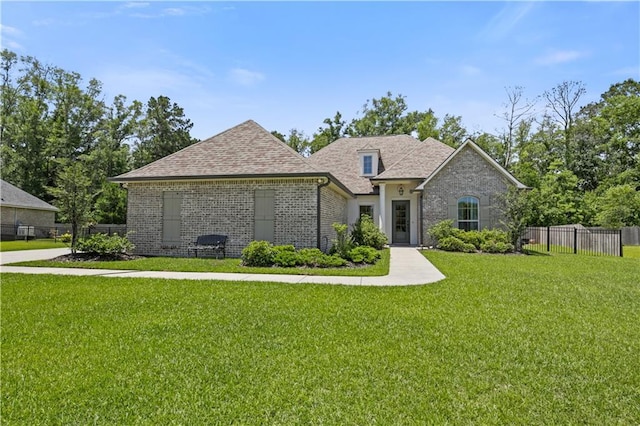 343 Saw Grass Loop, Covington, LA 70435 - french provincial home with brick siding and a shingled roof