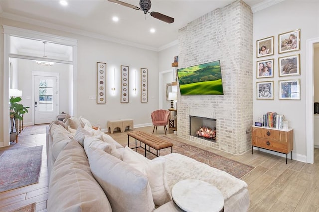 343 Saw Grass Loop, Covington, LA 70435 - living area featuring ceiling fan, wood finished floors, baseboards, a fireplace, and recessed lighting
