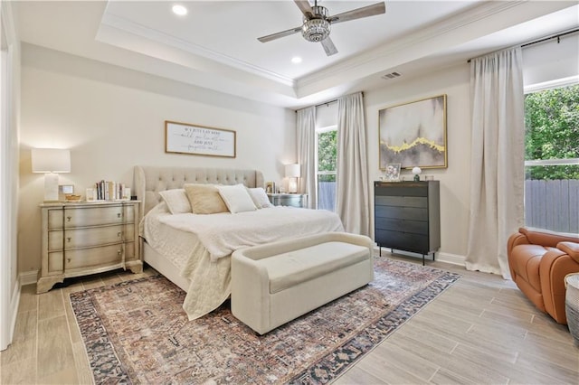 343 Saw Grass Loop, Covington, LA 70435 - bedroom with a raised ceiling, multiple windows, light wood-type flooring, ornamental molding, and recessed lighting