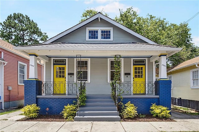 1705-07 Rousselin St, New Orleans, LA 70119 - view of front of home with a porch