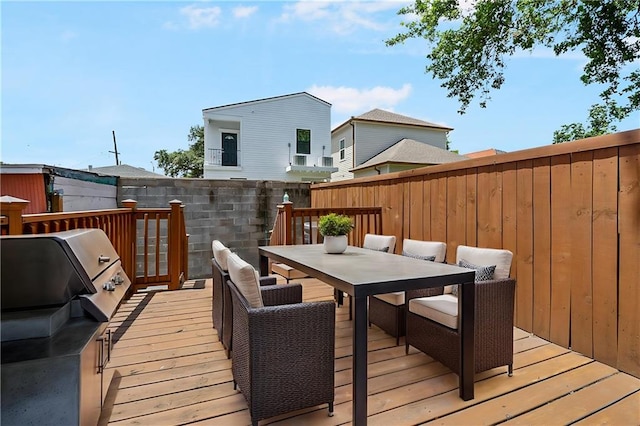 1705-07 Rousselin St, New Orleans, LA 70119 - wooden terrace featuring outdoor dining space, fence, and a grill