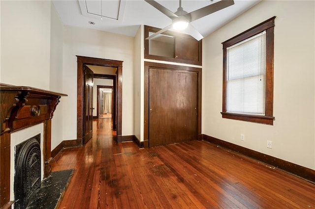 1705-07 Rousselin St, New Orleans, LA 70119 - unfurnished bedroom featuring wood-type flooring, a fireplace, baseboards, and attic access
