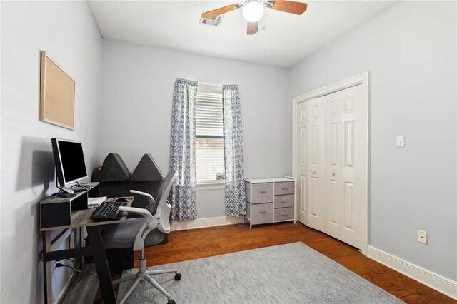 2107 Olvey Dr, Mandeville, LA 70448 - office with baseboards, a ceiling fan, and wood finished floors