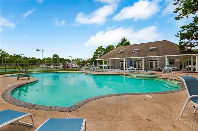2107 Olvey Dr, Mandeville, LA 70448 - community pool featuring french doors and a patio area