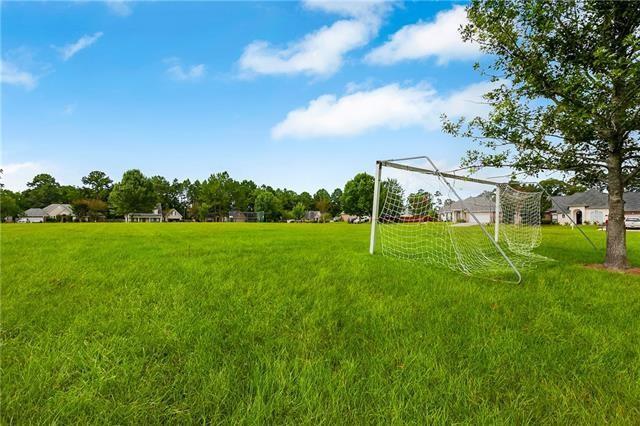 2107 Olvey Dr, Mandeville, LA 70448 - view of yard featuring an area for soccer