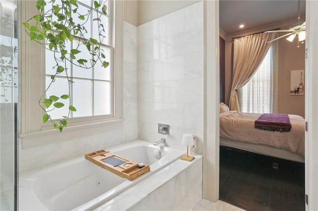 1807 Jena St, New Orleans, LA 70115 - ensuite bathroom with a bathtub and ceiling fan