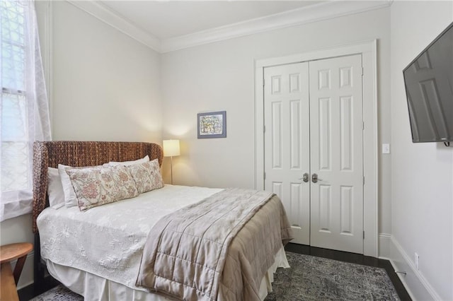 1807 Jena St, New Orleans, LA 70115 - bedroom featuring a closet, ornamental molding, and baseboards