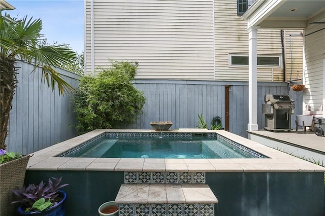 1807 Jena St, New Orleans, LA 70115 - view of swimming pool with area for grilling, an in-ground hot tub, and fence