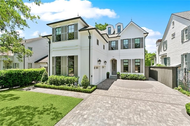 204 Vincent Ave, Metairie, LA 70005 - view of front of house with stucco siding and decorative driveway