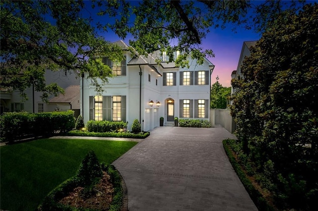 204 Vincent Ave, Metairie, LA 70005 - view of front of home featuring stucco siding, a front lawn, and concrete driveway