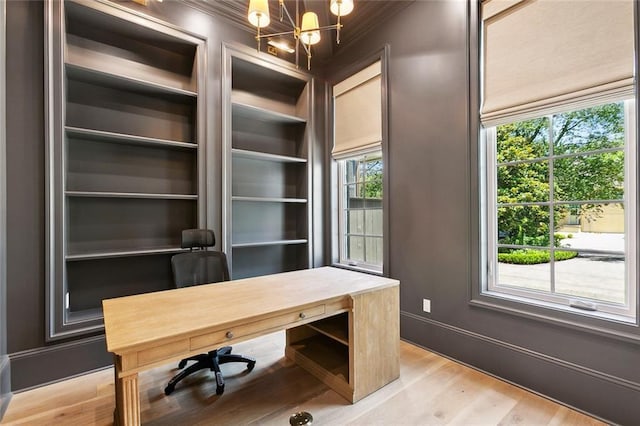 204 Vincent Ave, Metairie, LA 70005 - unfurnished office with a chandelier, light wood finished floors, baseboards, and ornamental molding