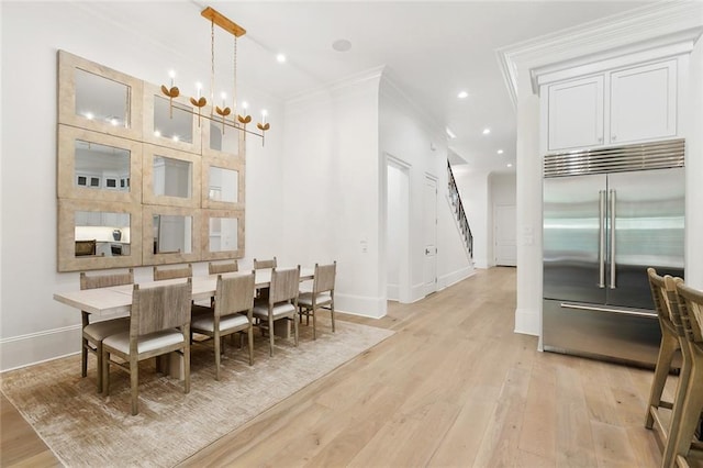 204 Vincent Ave, Metairie, LA 70005 - dining room featuring light wood-style floors, baseboards, a chandelier, crown molding, and recessed lighting