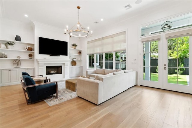 204 Vincent Ave, Metairie, LA 70005 - living area with healthy amount of natural light, ornamental molding, a chandelier, light wood-style flooring, and recessed lighting
