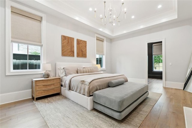 204 Vincent Ave, Metairie, LA 70005 - bedroom with crown molding, a raised ceiling, a chandelier, light wood-type flooring, and recessed lighting