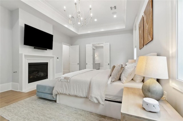 204 Vincent Ave, Metairie, LA 70005 - bedroom featuring wood finished floors, a tray ceiling, crown molding, a chandelier, and recessed lighting