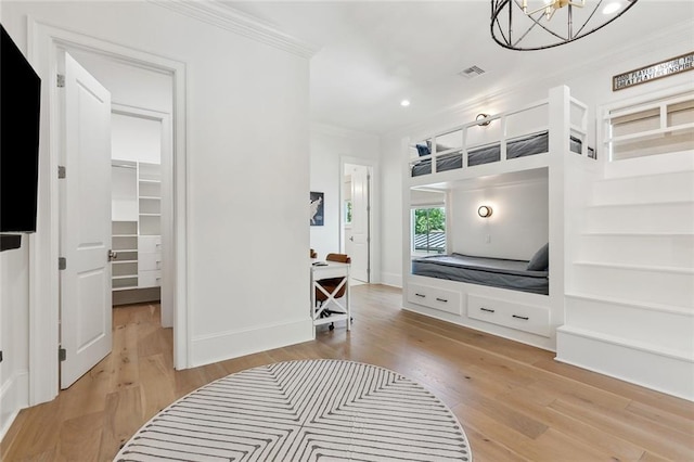 204 Vincent Ave, Metairie, LA 70005 - hallway with crown molding, a chandelier, light wood finished floors, recessed lighting, and built in shelves
