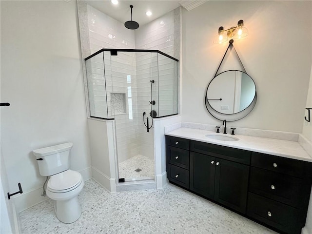 204 Vincent Ave, Metairie, LA 70005 - bathroom featuring baseboards, a stall shower, vanity, and toilet