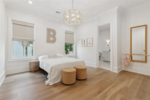 204 Vincent Ave, Metairie, LA 70005 - bedroom with ornamental molding, a chandelier, wood finished floors, baseboards, and connected bathroom