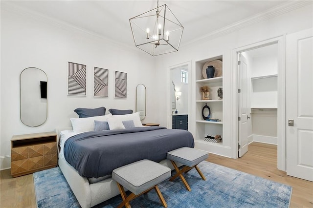 204 Vincent Ave, Metairie, LA 70005 - bedroom with light wood finished floors, ornamental molding, a walk in closet, a chandelier, and baseboards