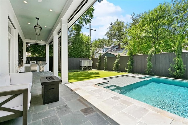204 Vincent Ave, Metairie, LA 70005 - view of swimming pool featuring exterior kitchen, a patio area, area for grilling, and an outdoor fire pit