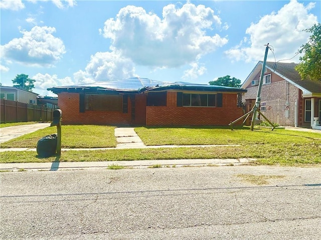 4710 Knight Dr, New Orleans, LA 70127 - view of front of home with brick siding and a front yard