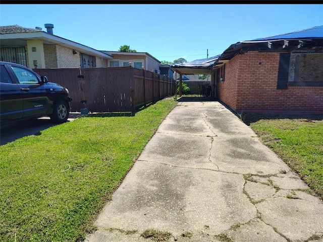 4710 Knight Dr, New Orleans, LA 70127 - view of side of home featuring brick siding and driveway