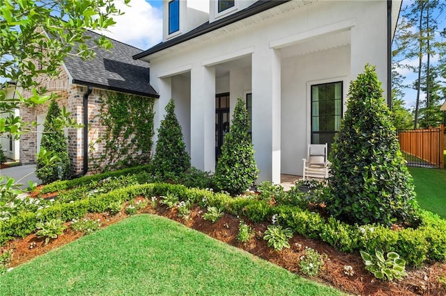 5072 Twin River Pl, Covington, LA 70433 - entrance to property featuring a shingled roof, stucco siding, and brick siding