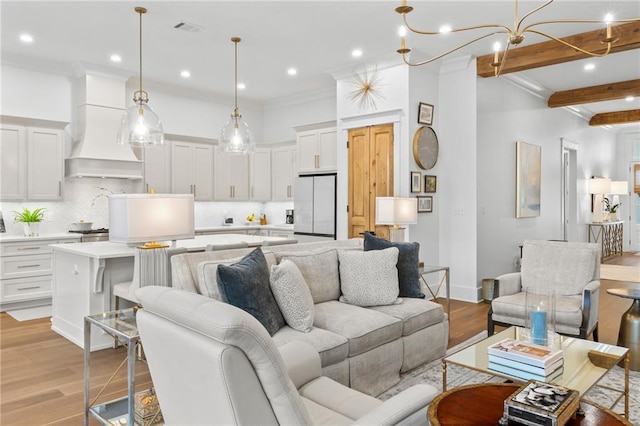 5072 Twin River Pl, Covington, LA 70433 - living area featuring light wood-type flooring, recessed lighting, ornamental molding, beam ceiling, and a chandelier