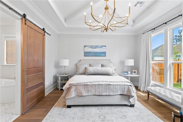 5072 Twin River Pl, Covington, LA 70433 - bedroom with a barn door, a tray ceiling, a chandelier, baseboards, and crown molding