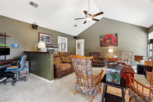 carpeted living area with ceiling fan, vaulted ceiling, a desk, and baseboards