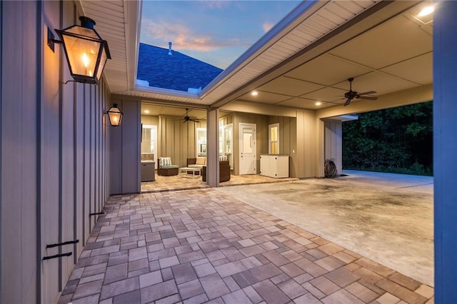 1029 Spring Haven Ln, Madisonville, LA 70447 - patio terrace at dusk with a ceiling fan and a patio area